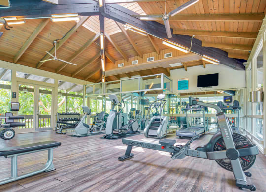 a gym with treadmills and other exercise equipment at the resort  at Rancho Los Feliz, Los Angeles, California