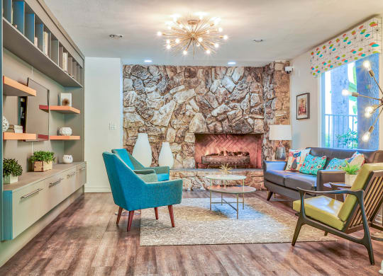 a living room with a stone walled fireplace  at Rancho Los Feliz, Los Angeles, 90039