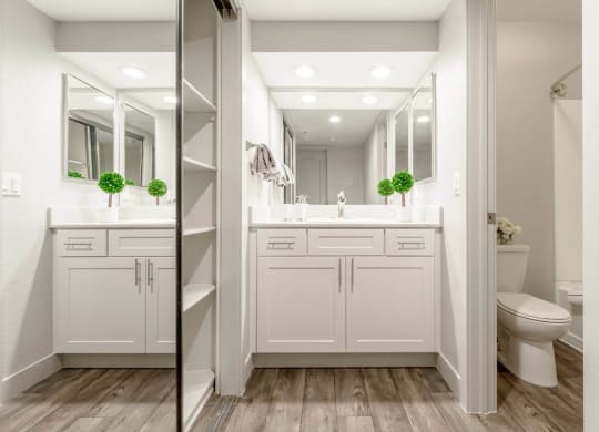A bathroom vanity and closet at Sendero Huntington Beach, California