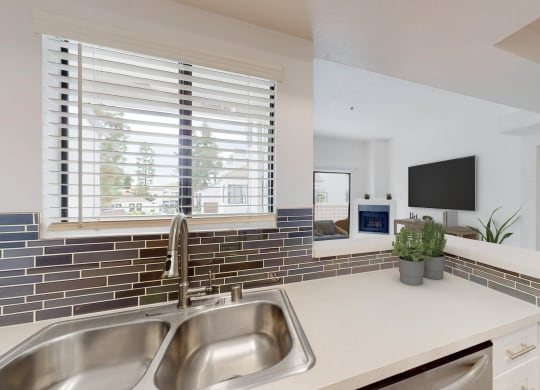 a kitchen with a sink and a window at Sendero Huntington Beach, California, 92647