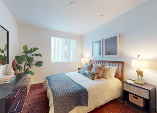 a bedroom with a bed and a dresser at The Villas at Anacapa Canyon, Camarillo