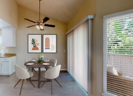 a dining room with a table and chairs and a ceiling fan at Valley Plaza Villages, Pleasanton