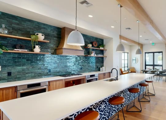 a large kitchen with a long white counter top at The Villas at Anacapa Canyon, California
