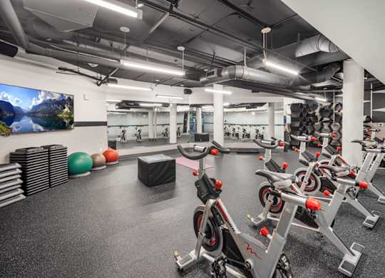 Yoga room and stationary bicycle in the fully-equipped gym at Esprit Apartments, Marina del Rey, CA, 90292