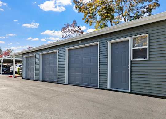 A long building with four garage doors.
