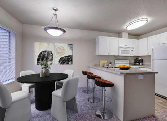 Open kitchen and dining area with peninsula seating and contemporary lighting.