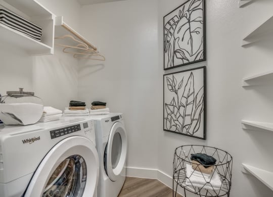 a washer and dryer in a laundry room at Aurora Watson Branch, Mansfield, Texas