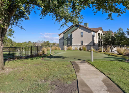 a golf course in front of a house at The Fairways at Star Ranch, Hutto, Texas