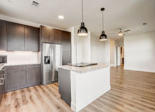 a kitchen with a island and a stainless steel refrigerator at Aurora Watson Branch, Texas, 76063