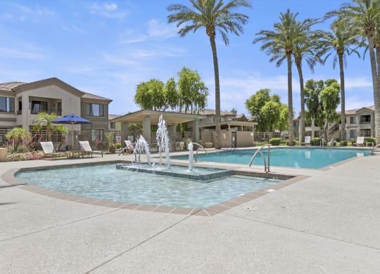 take a dip in the resort style pool at the whispering winds apartments in pearland, tx  at Adiamo Palm Valley, Goodyear, AZ, 85395