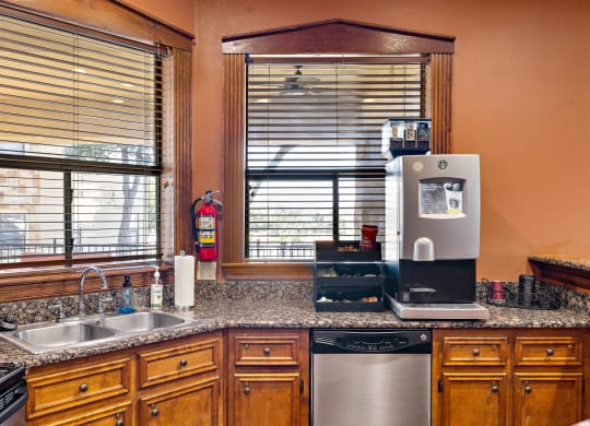 the kitchen has granite counter tops and stainless steel appliances at The Verandah, Texas
