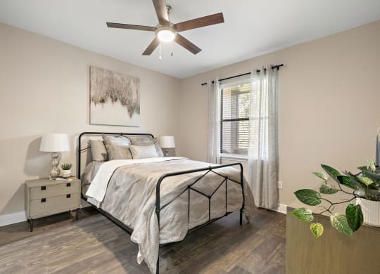 a bedroom with a ceiling fan and a bed at The Verandah, Texas