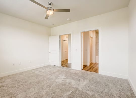 a spacious living room with carpet and a ceiling fan at Aurora Watson Branch, Mansfield, 76063