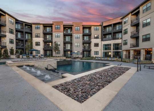 take a dip in the resort style pool at the bradley braddock road station apartments  at Aurora Watson Branch, Mansfield, Texas