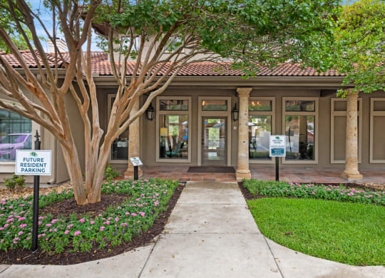 A building with a tree in front of it at Waters Edge Apartment Homes, Texas