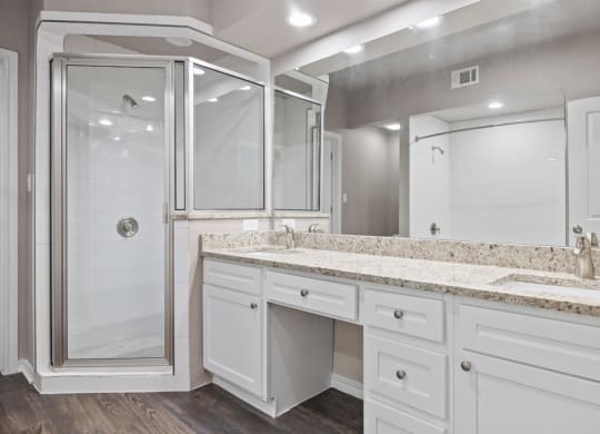 A bathroom with a sink and a shower at Waters Edge Apartment Homes, Texas