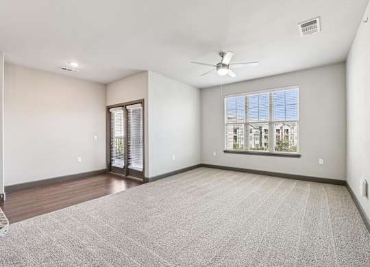 A room with a carpeted floor and a ceiling fan.at North Creek, Hutto