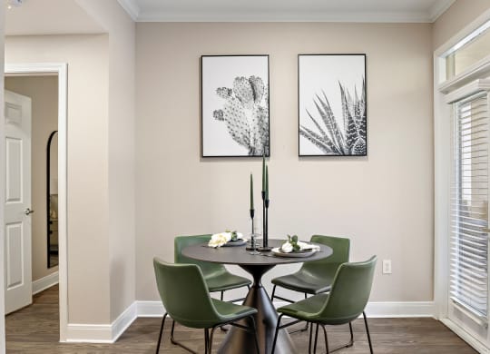 a dining room with a table and chairs and two pictures on the wall at The Verandah, Austin, Texas