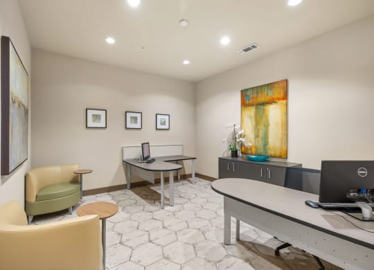 an office with a desk and chairs and a computer at Lakeline East Apartments, Texas