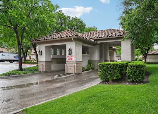 A house with a red roof and a sign that says