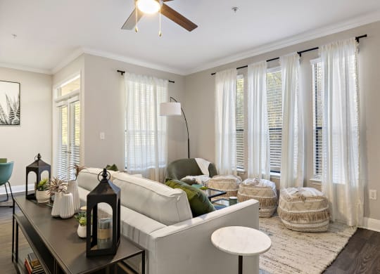 a living room with white curtains and a white couch at The Verandah, Texas, 78726