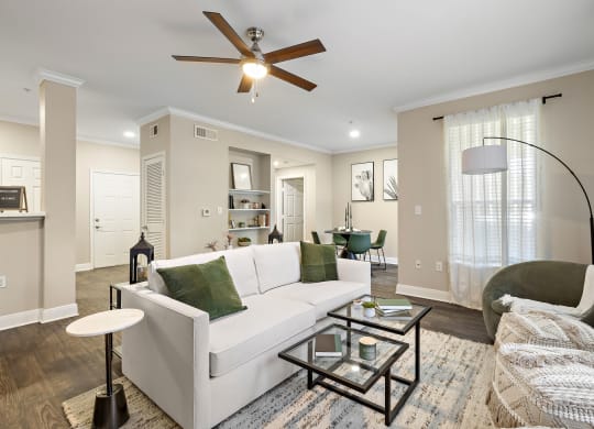 a living room with a white couch and a ceiling fan at The Verandah, Austin, Texas