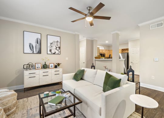 a living room with a white couch and a ceiling fan at The Verandah, Austin, 78726