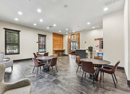 A room with a table and chairs in it.
