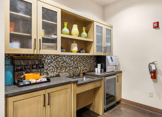 a kitchen with a sink and cabinets and a fire hydrant at Lakeline East Apartments, Texas, 78613