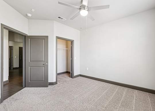 A room with a ceiling fan and a rug on the floor. at North Creek, Texas, 78634