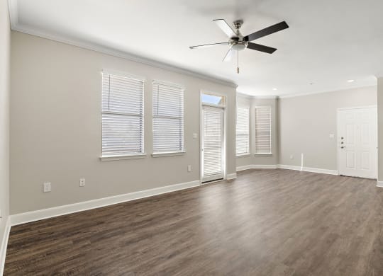 an empty living room with wood floors and a ceiling fan at The Verandah, Texas, 78726