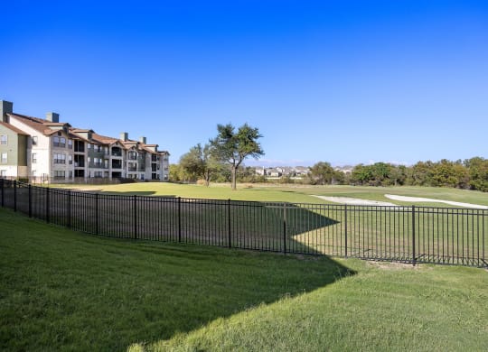 a view of the golf course at the preserve at polk apartments at The Fairways at Star Ranch, Hutto, Texas