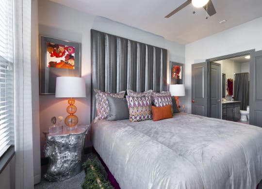 a bedroom with a large bed and a mirror at North Creek, Hutto, 78634