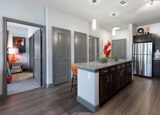 a kitchen with a large island in the middle of it at North Creek, Texas