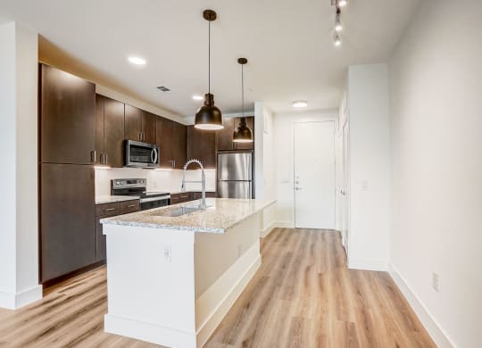 a kitchen with a large island and a stainless steel refrigerator at Aurora Watson Branch, Texas, 76063