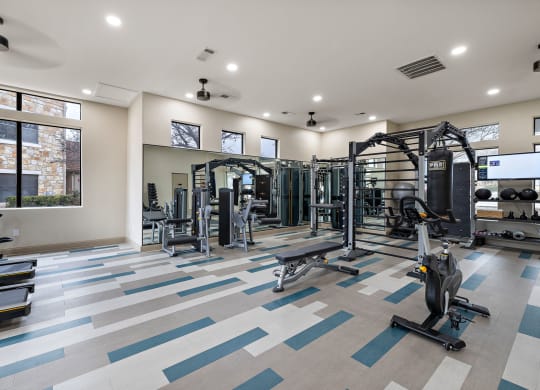 A gym with cardio equipment at Waters Edge Apartment Homes, Georgetown, TX, 78626