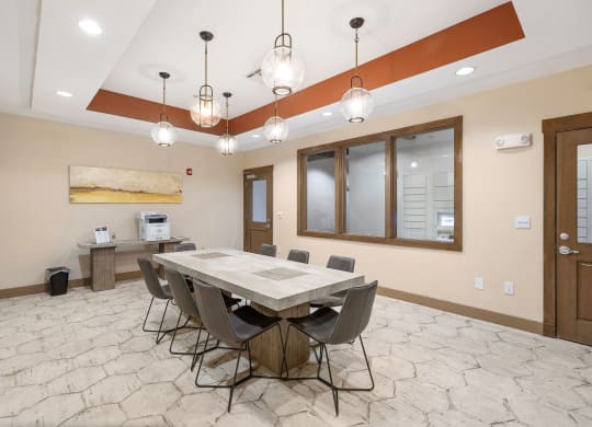 a dining room with a table and chairs at Lakeline East Apartments, Texas, 78613