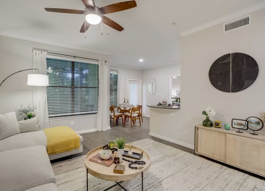 a living room with a couch and a ceiling fan at The Vista on Brodie, Austin, TX, 78745