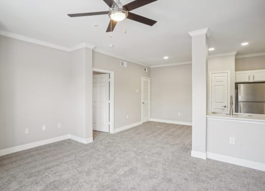 an empty living room with a ceiling fan  at The Verandah, Austin, TX, 78726