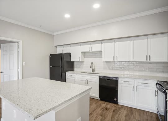 a kitchen with white cabinets and a white counter top  at The Verandah, Texas, 78726
