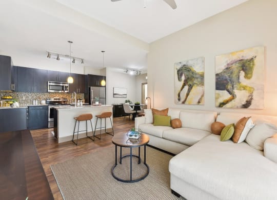 a living room with a couch and a table at Lakeline East Apartments, Texas, 78613