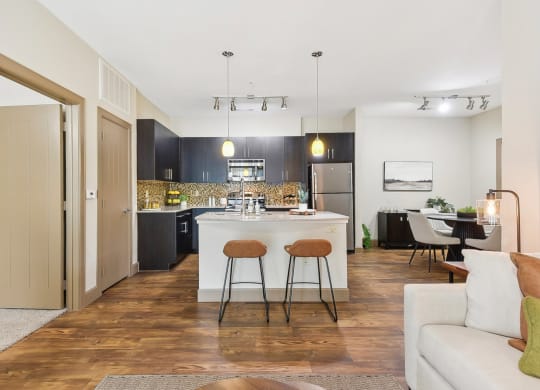 a view of a living room and kitchen with an open floor plan  at Lakeline East Apartments, Cedar Park, TX, 78613
