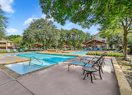 Pool With Lounge Chairs at The Canyons Apartments, Fort Worth, TX, 76116
