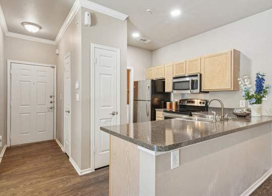 a kitchen with a granite counter top and a
