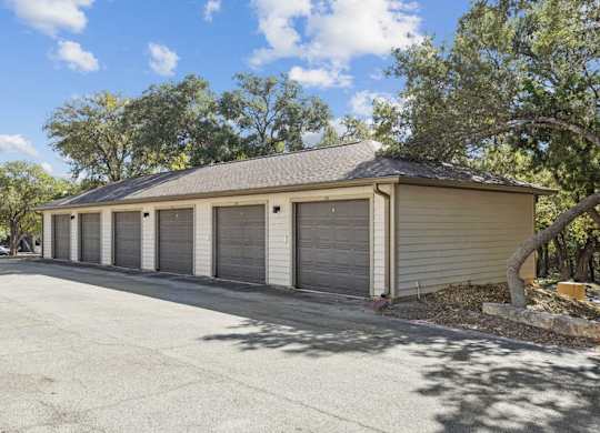 a garage with four roll up garage doors