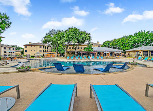 Poolside Relaxing Chairs at The Canyons Apartments, Fort Worth, TX