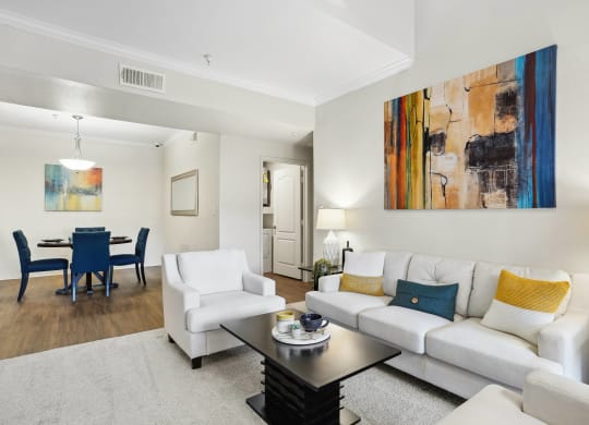 a living room with a couch and a coffee table at La Ventura Apartments, Texas, 75093