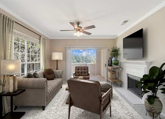 a living room with couches and chairs and a tv