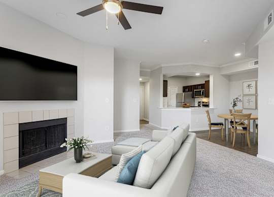 a living room with a couch and a fireplace at The Legends at Eagle Mountain Lake, Fort Worth, Texas