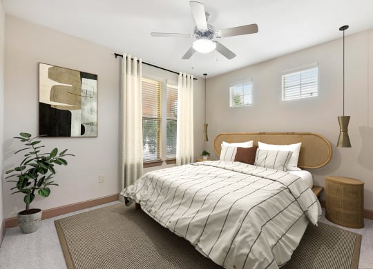a bedroom with a large bed and a ceiling fan at Lakeline East Apartments, Texas, 78613
